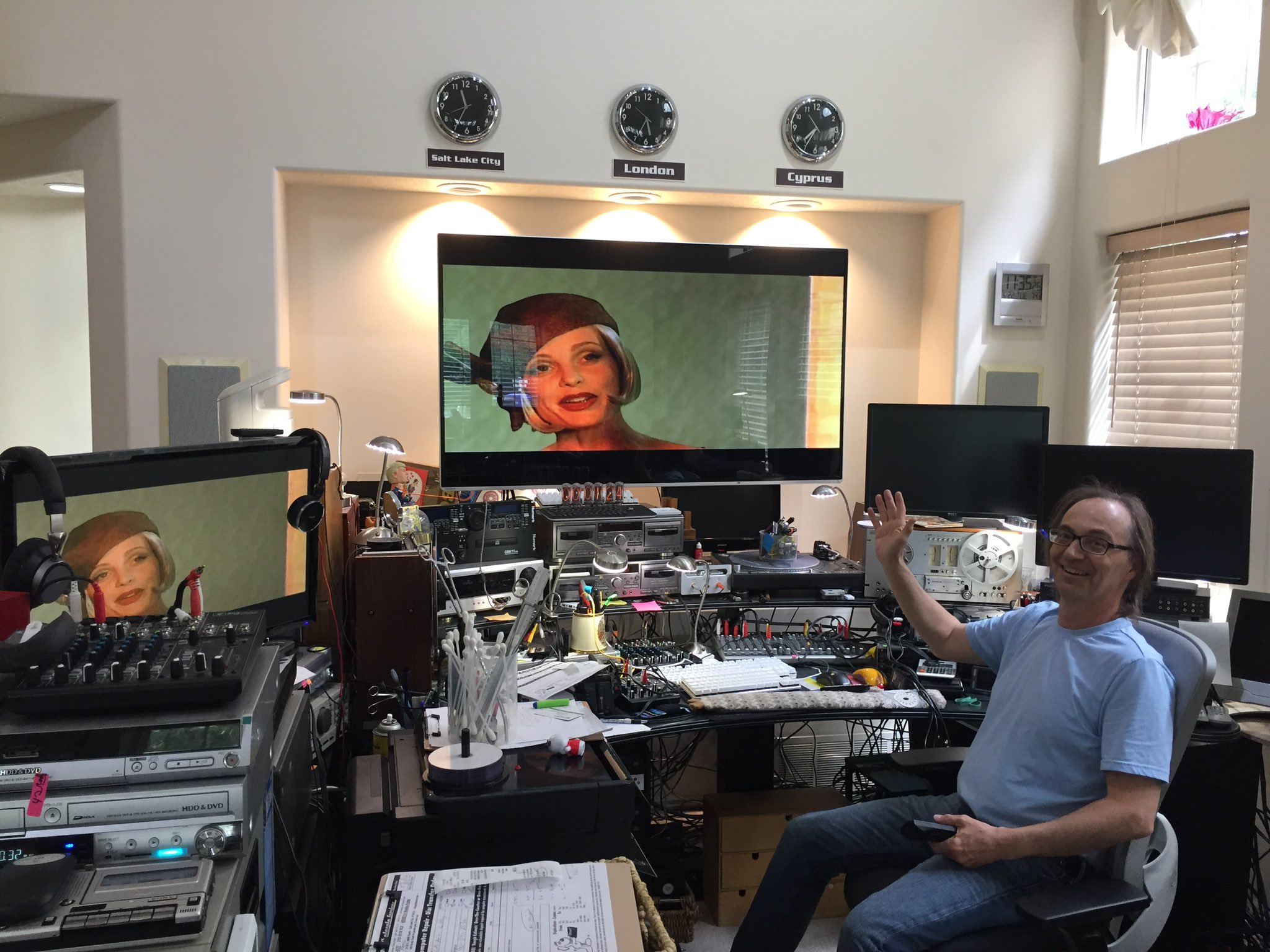 Video Wholesale Services digitizing Tex Murphy tapes. Mark Greer sits in front of an array of monitors and video recording equipment while digitizing Tex Murphy Overseer tapes (which can be seen on screen).