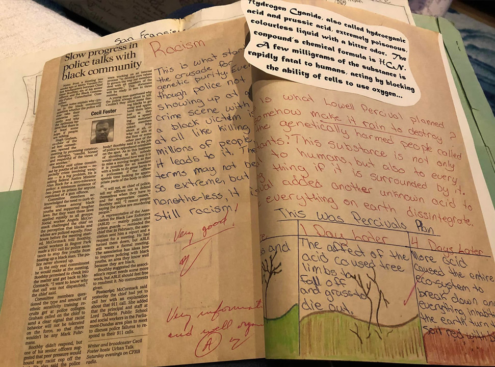 Inside Pam's Under a Killing Moon scrapbook. Pages detail the prevalence of racism in real-life and how it compares to Lowell Percival's motivations in the Under a Killing Moon story.