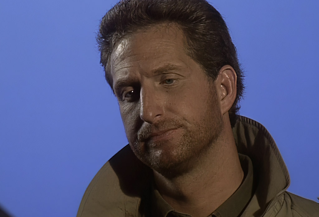 Tex Murphy, played by Chris Jones from The Pandora Directive on the upscaled source footage, on a blue screen background.